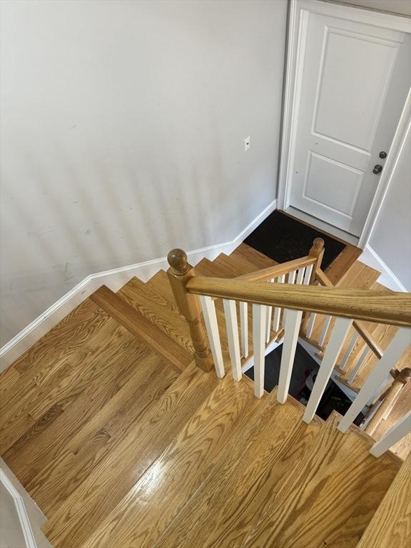 stairway featuring hardwood / wood-style floors