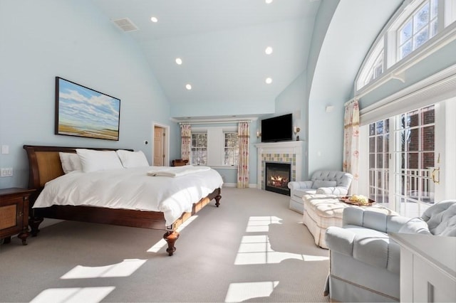 carpeted bedroom featuring visible vents, a tiled fireplace, recessed lighting, high vaulted ceiling, and access to outside