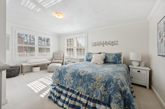 bedroom with carpet flooring, crown molding, and baseboards