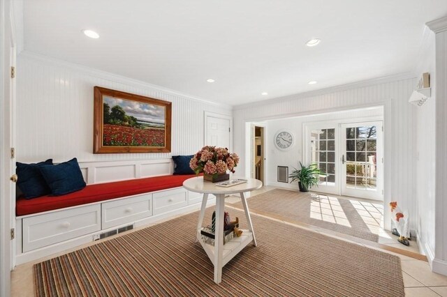 interior space with crown molding, light tile patterned flooring, french doors, and recessed lighting