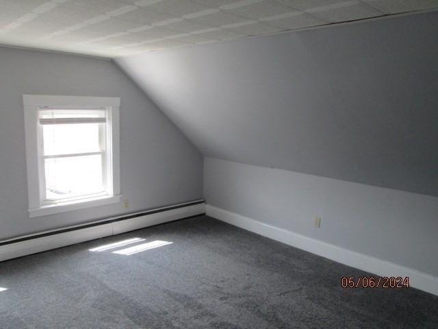 16 Chestnut, Wakefield, MA 01880 - additional living space with carpet flooring, a baseboard radiator, lofted ceiling, and baseboards
