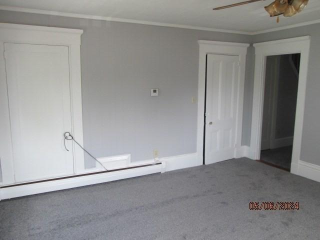 16 Chestnut, Wakefield, MA 01880 - carpeted spare room featuring a baseboard heating unit, crown molding, ceiling fan, and baseboards