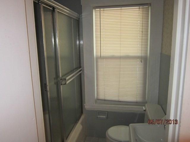 16 Chestnut, Wakefield, MA 01880 - bathroom featuring toilet and bath / shower combo with glass door