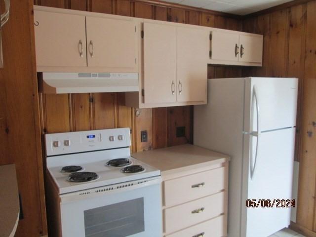 16 Chestnut, Wakefield, MA 01880 - kitchen with white appliances, under cabinet range hood, light countertops, and white cabinets