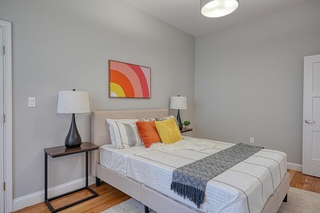 bedroom featuring wood-type flooring