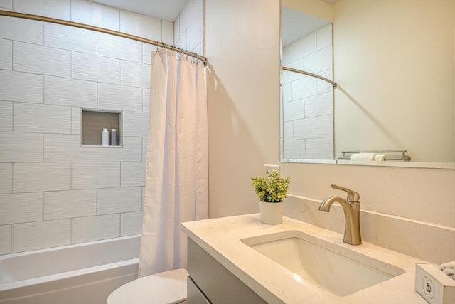 full bathroom featuring vanity, shower / bath combo, and toilet