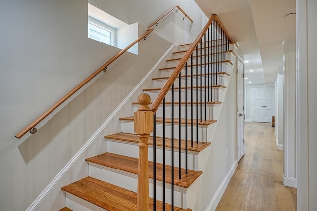 staircase featuring hardwood / wood-style floors