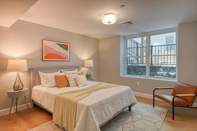 bedroom with light hardwood / wood-style floors