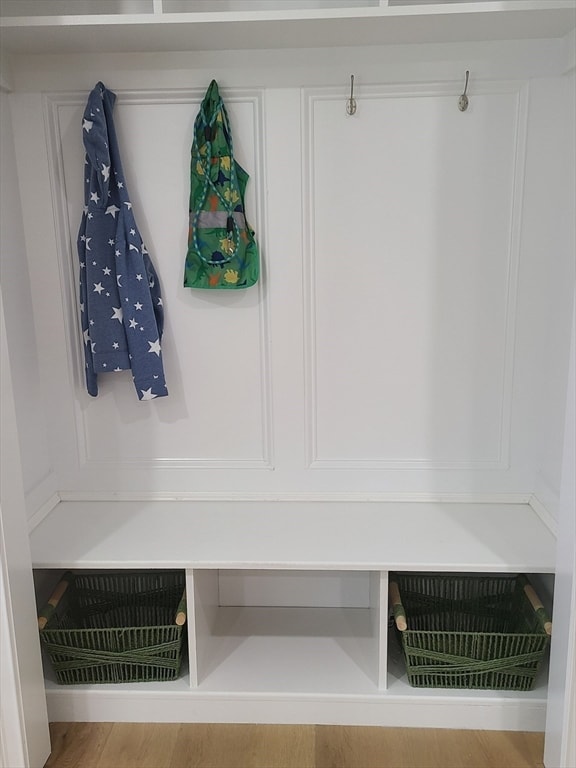 mudroom with light hardwood / wood-style flooring