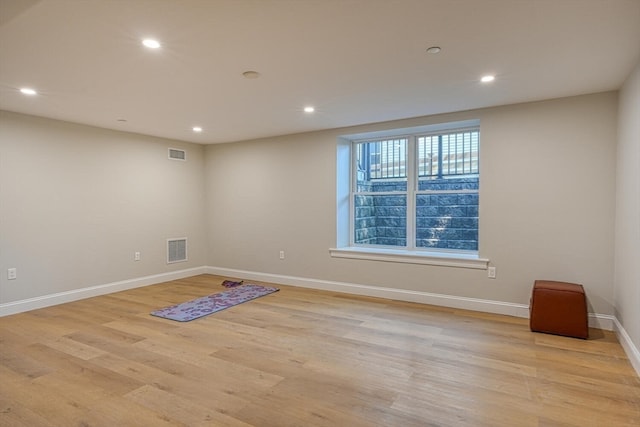 unfurnished room featuring light hardwood / wood-style floors