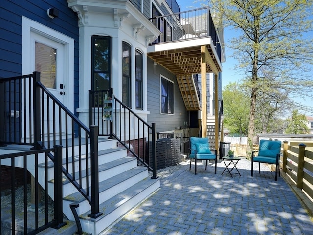 wooden deck with a patio area