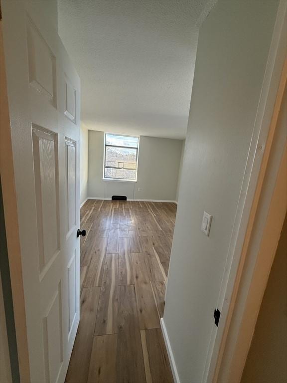 corridor featuring light wood-type flooring