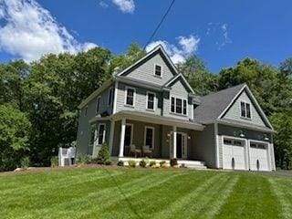220 Mill St, Burlington, MA 01803 - view of front of property featuring a porch, a front lawn, and driveway
