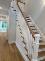 220 Mill St, Burlington, MA 01803 - stairway featuring baseboards and wood finished floors