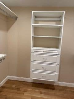 220 Mill St, Burlington, MA 01803 - walk in closet featuring wood finished floors