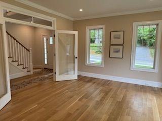220 Mill St, Burlington, MA 01803 - foyer entrance featuring baseboards, wood finished floors, crown molding, and stairs
