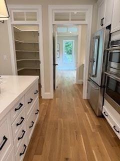 220 Mill St, Burlington, MA 01803 - hall with light wood finished floors
