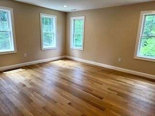 220 Mill St, Burlington, MA 01803 - unfurnished room featuring baseboards and dark wood-style flooring