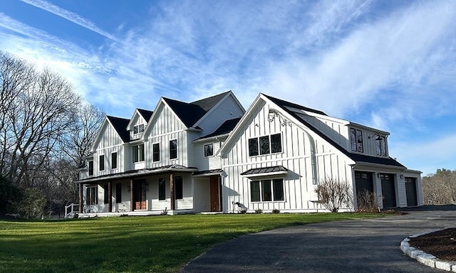 exterior space featuring a front yard, a porch, and a garage