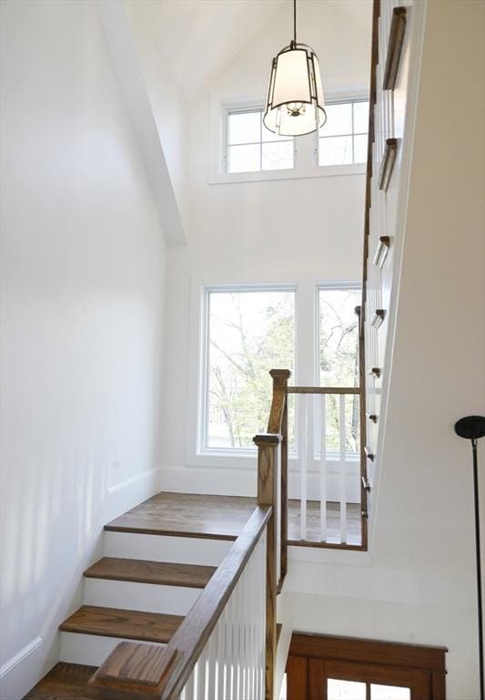 stairs with lofted ceiling