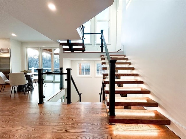 stairs with wood-type flooring