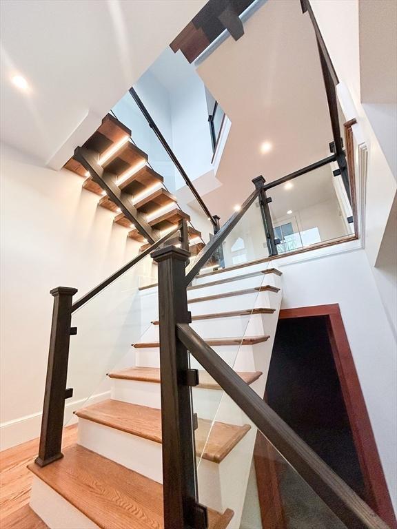 stairway featuring hardwood / wood-style flooring