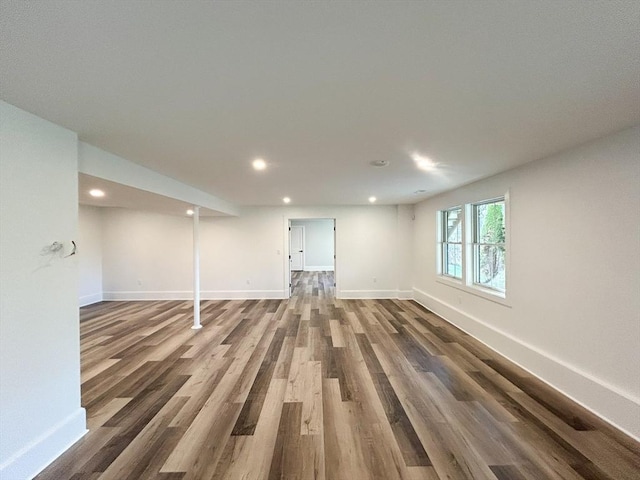 basement featuring dark hardwood / wood-style flooring