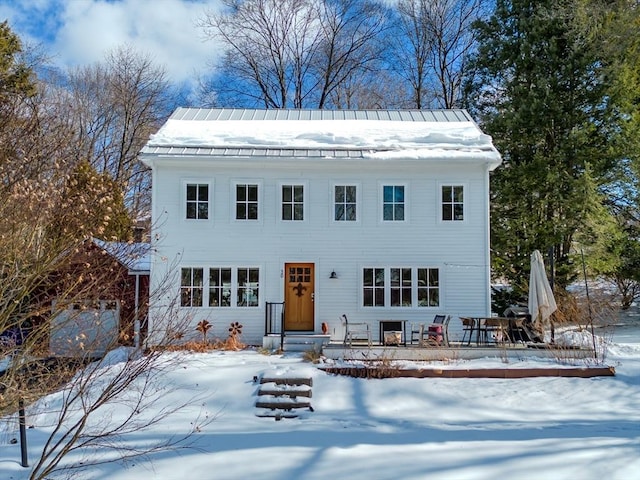 colonial home with metal roof