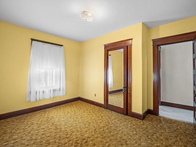 unfurnished room with carpet flooring