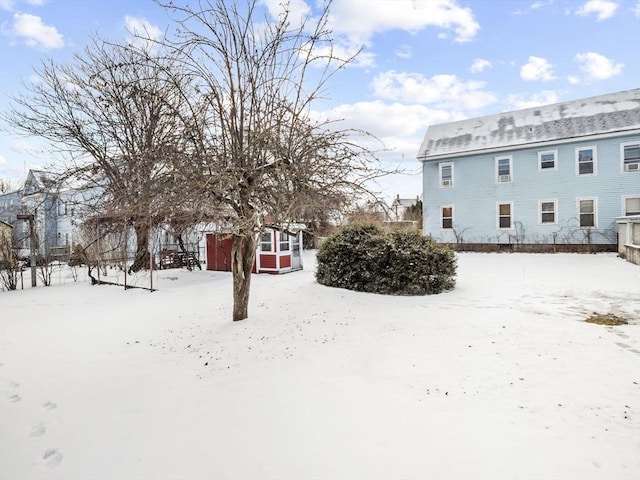 view of yard layered in snow