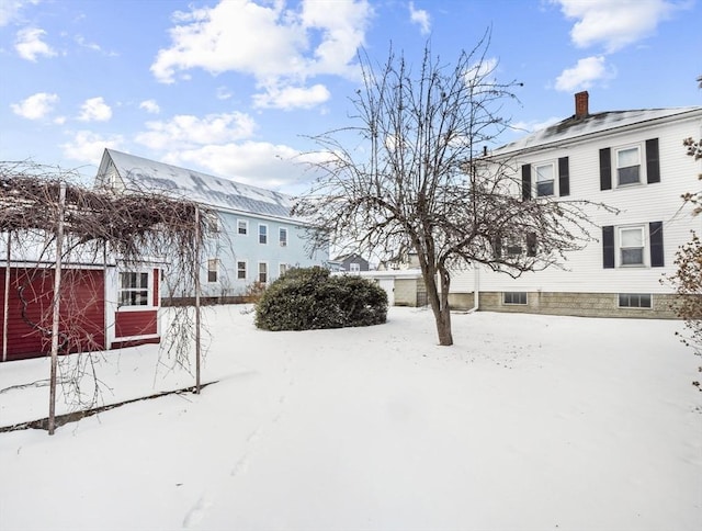 view of yard covered in snow