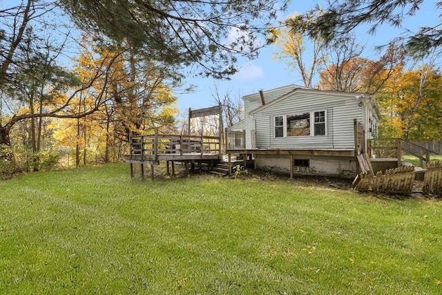 exterior space with a wooden deck and a yard