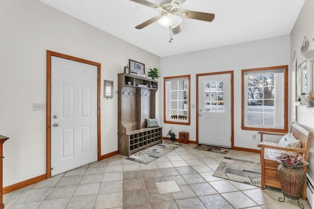 mudroom featuring light tile patterned floors and ceiling fan