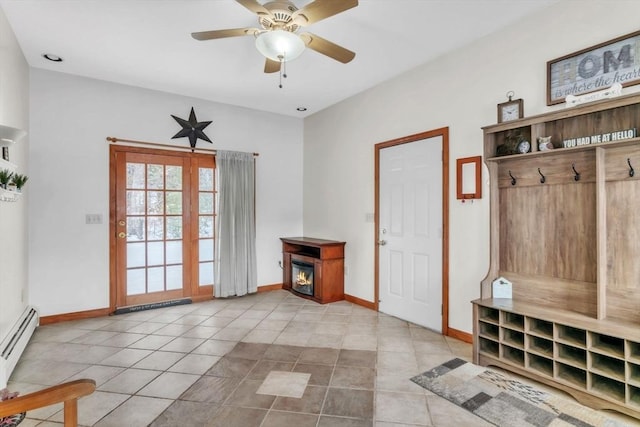 mudroom featuring ceiling fan, a baseboard radiator, and light tile patterned floors