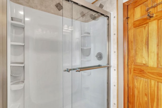 bathroom featuring an enclosed shower