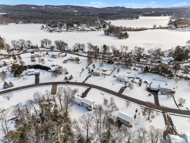 snowy aerial view featuring a mountain view