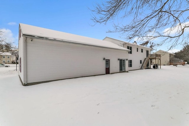 view of snow covered house