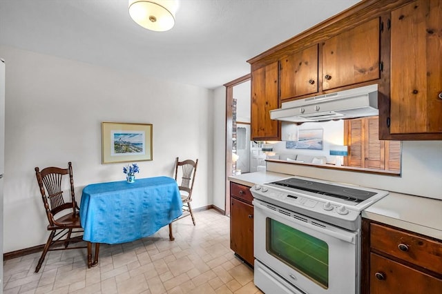 169 Mountainview Rd, East Longmeadow, MA 01028 - kitchen featuring electric stove, under cabinet range hood, light countertops, and brown cabinetry