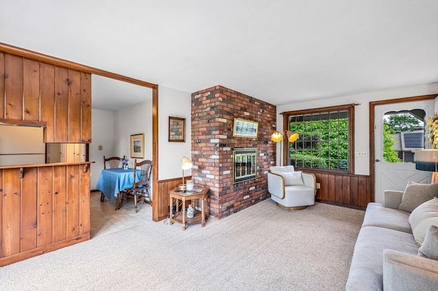 169 Mountainview Rd, East Longmeadow, MA 01028 - living area with a brick fireplace, a wainscoted wall, carpet floors, and wooden walls