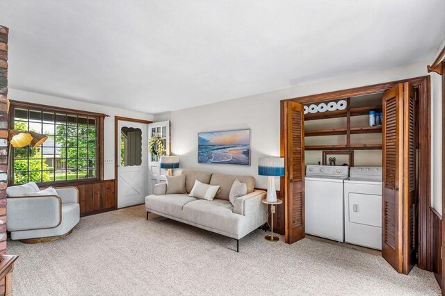 169 Mountainview Rd, East Longmeadow, MA 01028 - living area with washing machine and dryer, light colored carpet, and a wainscoted wall