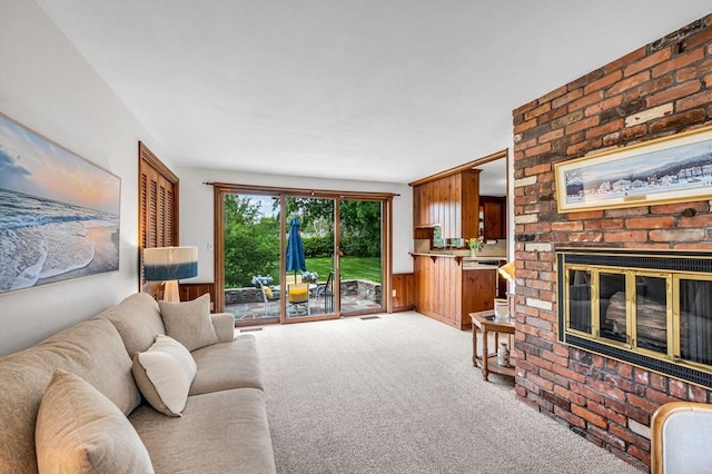 169 Mountainview Rd, East Longmeadow, MA 01028 - living room featuring a fireplace, light carpet, and wainscoting