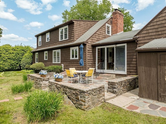 169 Mountainview Rd, East Longmeadow, MA 01028 - rear view of house featuring a chimney, a patio, and roof with shingles