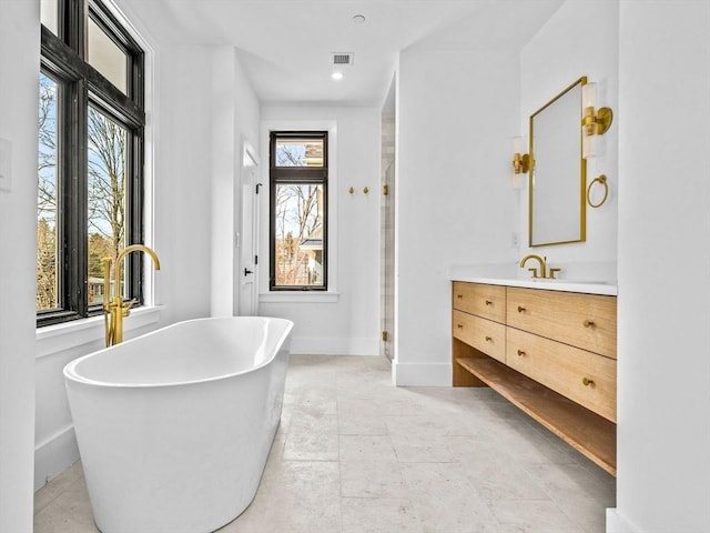 bathroom featuring vanity and plus walk in shower