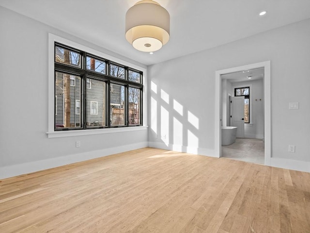 unfurnished room featuring hardwood / wood-style flooring