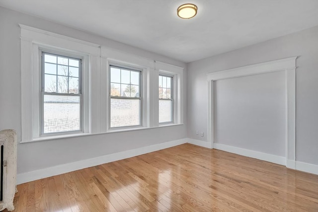 unfurnished room featuring light hardwood / wood-style flooring