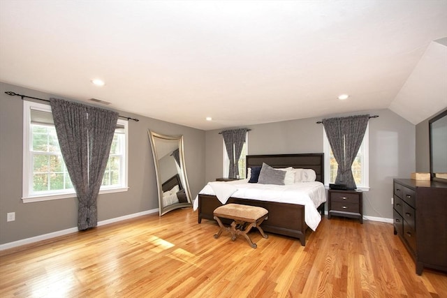 bedroom featuring recessed lighting, visible vents, vaulted ceiling, light wood-type flooring, and baseboards