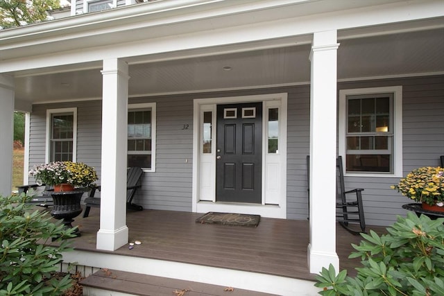 doorway to property with covered porch