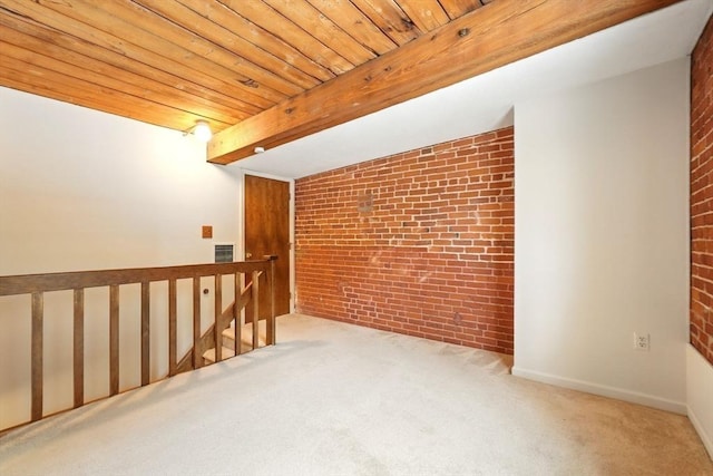 124 College St Unit 20, South Hadley, MA 01075 - unfurnished room with brick wall, carpet floors, and wood ceiling with exposed beams