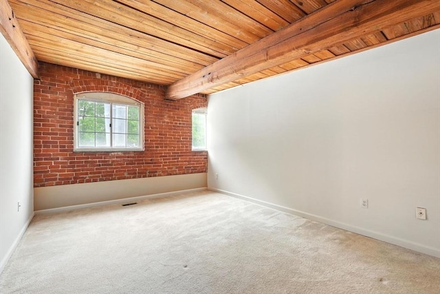 124 College St Unit 20, South Hadley, MA 01075 - unfurnished room with carpet flooring, wood ceiling, brick wall, and baseboards