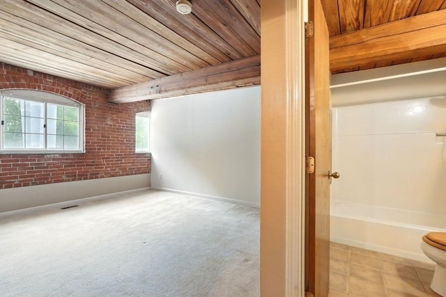 124 College St Unit 20, South Hadley, MA 01075 - interior space with wood ceiling, brick wall, toilet, and baseboards